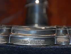Fig. 1. Sterling silver marks (left to right). F&S = Maker's Mark (Fattorini & Sons); Crown: Assay Mark for city of Sheffield; Lion Passant: Sterling silver 92.5% silver; "o" : year mark for 1906